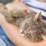 Woman cuddling her cat.