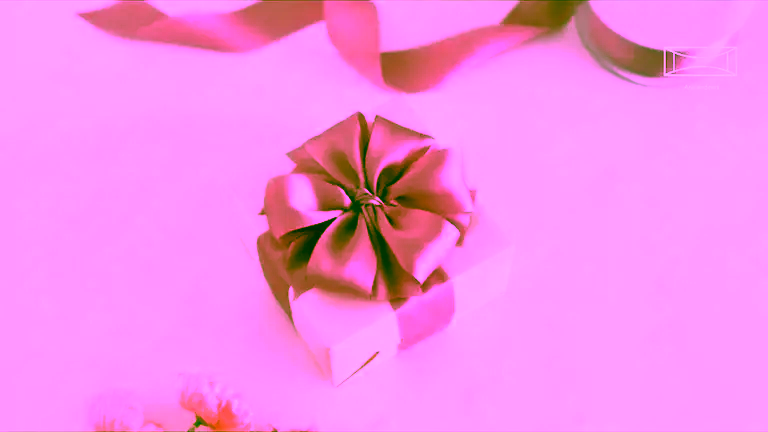 Beautiful gift-wrapping with satin ribbon.