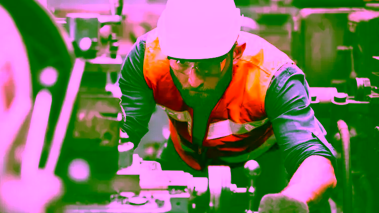 Labor-Day-Worker Factory worker wearing hard hat.