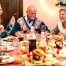 Multi-generational family having christmas dinner together.