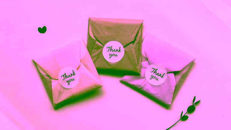 Beautiful gift-wrapping with colorful pastel tissue paper.