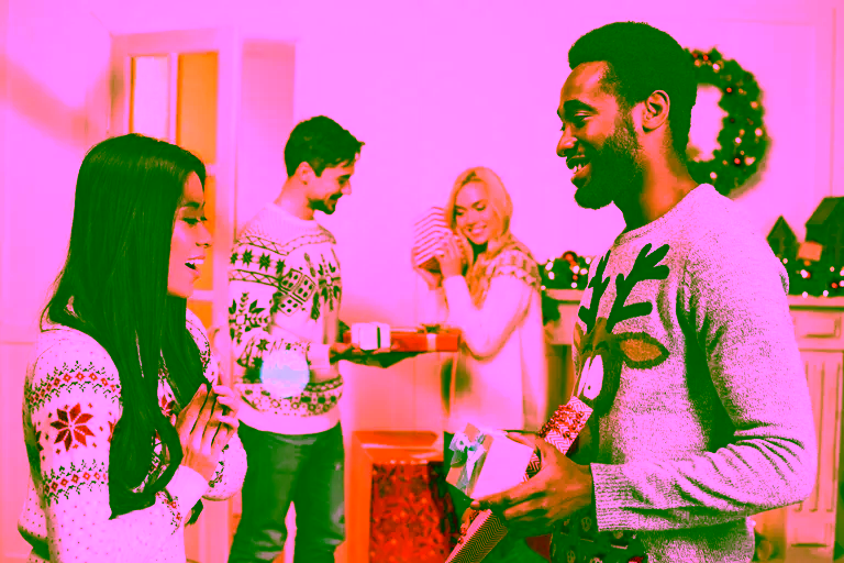Multi-ethnic young couples exchanging christmas gifts.